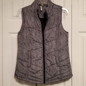 Red Camel puffer vest. Black and white Herringbone full zip. Front pockets.